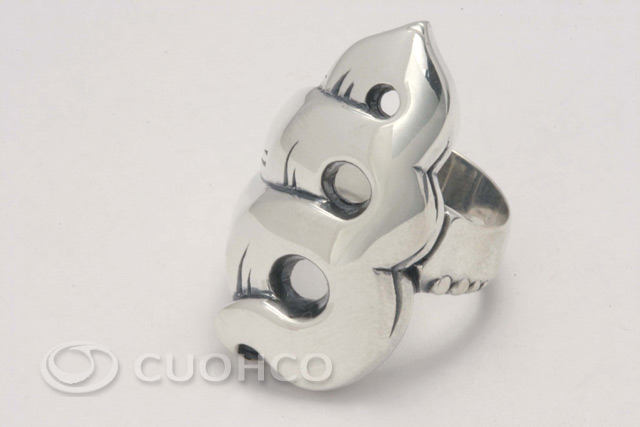 Sterling silver ring with central motif of curves that evokes a conch