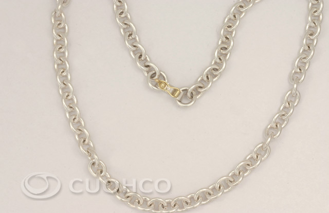 Solid sterling silver chain of circular links with 18-carat gold clasp