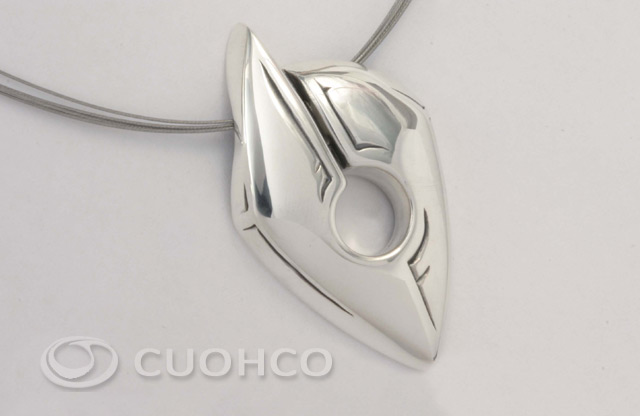 Sterling silver pendant shaped like a stylized African mask