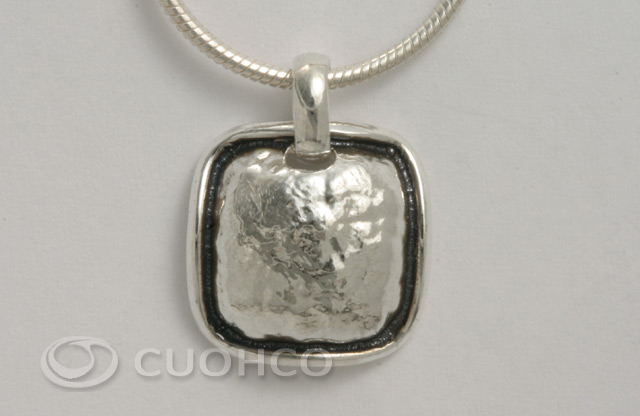 Sterling pendant of square motif with hammered texture