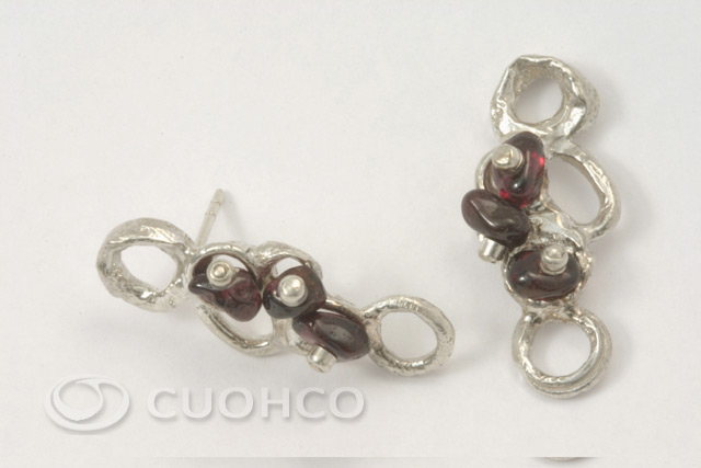 Short earrings made of sterling silver and natural garnets