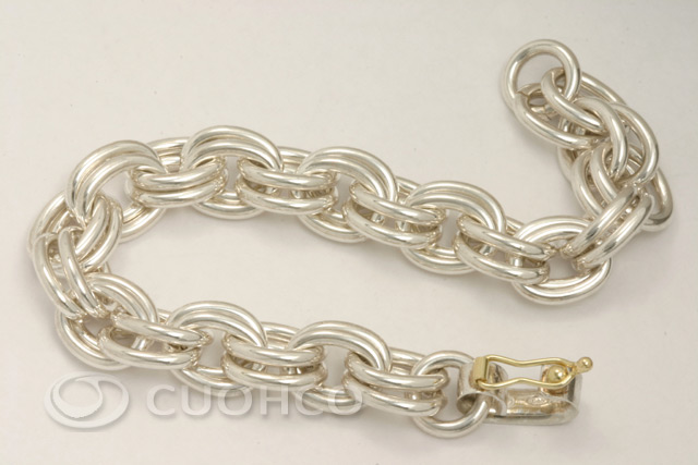 Solid sterling silver bracelet of double oval links with 18-carat gold clasp 