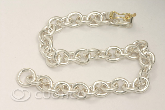 Solid sterling silver bracelet of plain links with 18-carat gold clasp
